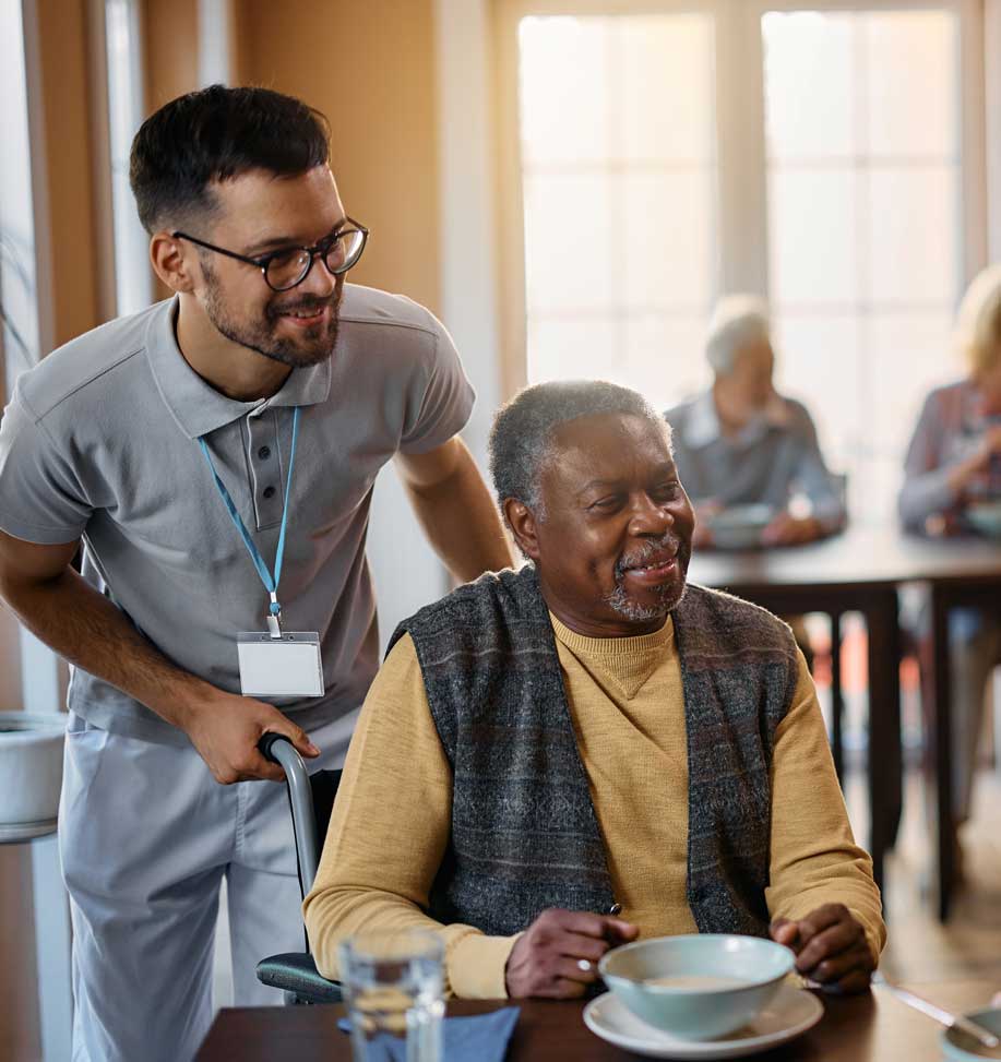 staff helping senior