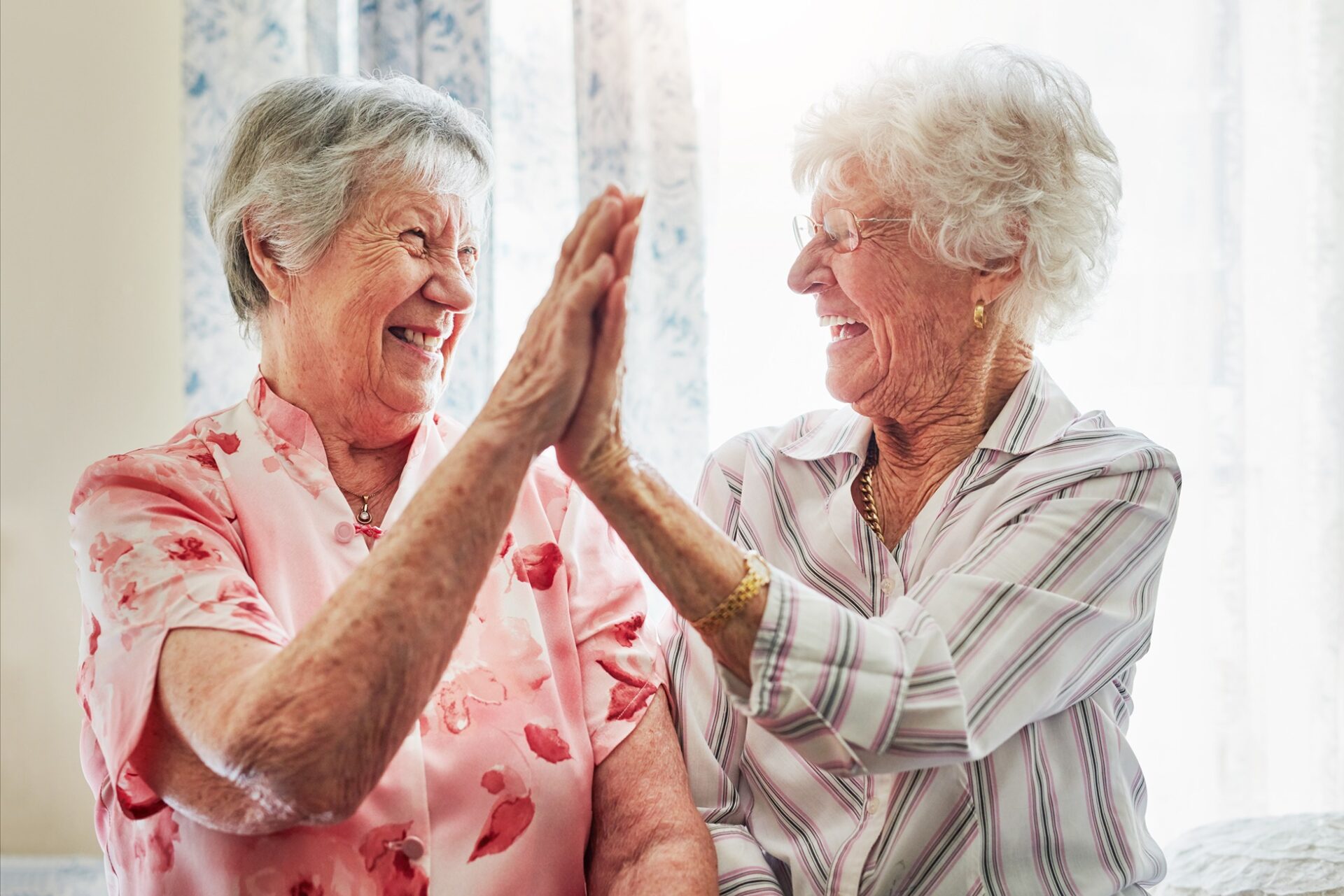 Two people high-fiving