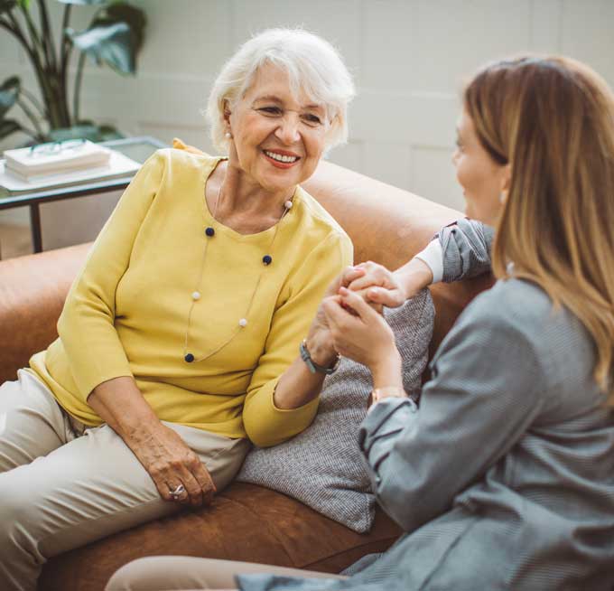 woman sitting with senior