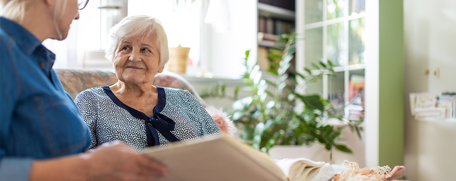 senior woman being read to