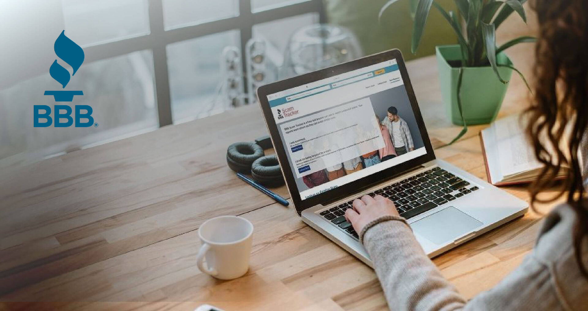 Woman using laptop at her desk